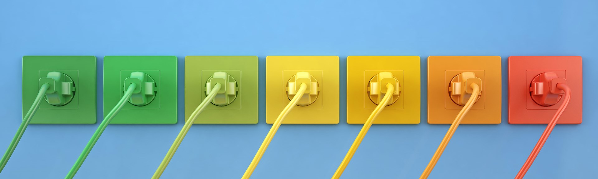 Energieausweis An der Wand befinden sich in einer Reihe Steckdosen mit Stecker in den Regenbogen Farben.